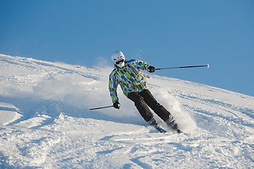 Image showing Skiing in fresh powder snow