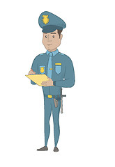 Image showing Young hispanic traffic policeman writing fine bill