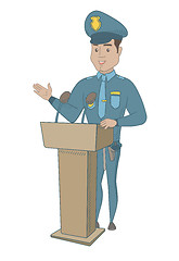 Image showing Young policeman giving a speech from the tribune.