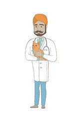 Image showing Young indian veterinarian with cat in hands.