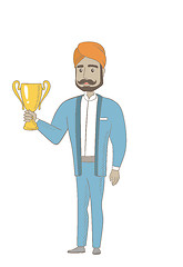 Image showing Hindu businessman holding a trophy.