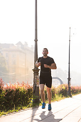 Image showing man jogging at sunny morning