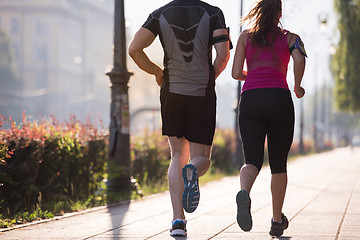 Image showing young couple jogging  in the city