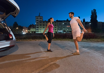 Image showing couple warming up and stretching