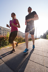 Image showing young couple jogging  in the city