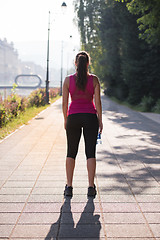 Image showing woman jogging at sunny morning