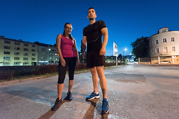 Image showing couple warming up and stretching