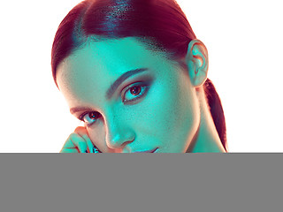 Image showing High Fashion model woman in colorful bright lights posing in stu