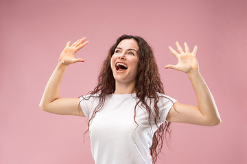 Image showing Winning success woman happy ecstatic celebrating being a winner. Dynamic energetic image of female model