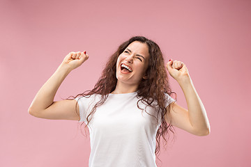 Image showing Winning success woman happy ecstatic celebrating being a winner. Dynamic energetic image of female model