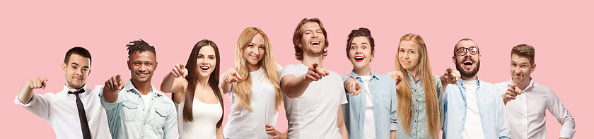 Image showing The happy business women and men point you and want you, half length closeup portrait on pink background.