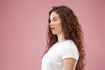 Image showing Beautiful woman looking bewildered isolated on pink