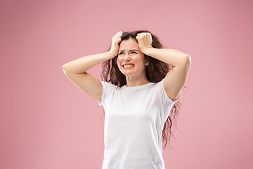 Image showing Beautiful woman looking bewildered isolated on pink