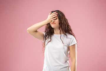 Image showing Beautiful woman looking bewildered isolated on pink