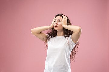 Image showing Beautiful woman looking bewildered isolated on pink