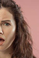 Image showing Beautiful woman looking bewildered isolated on pink