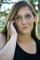 Image showing Beautiful Girl in the Park in a Black Dress Talking on the Phone