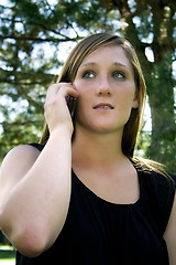 Image showing Beautiful Girl in the Park in a Black Dress Talking on the Phone