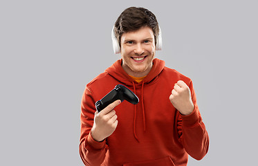 Image showing man with gamepad playing video game