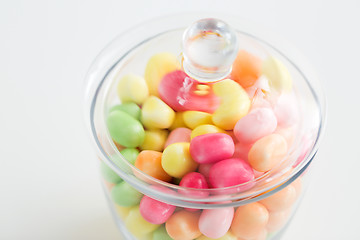 Image showing close up of glass jar with colorful candy drops