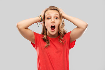 Image showing impressed or shocked teenage girl in red t-shirt