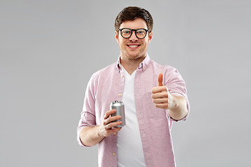 Image showing happy man with soda in tin can showing thumbs up