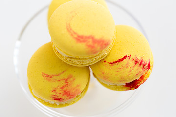 Image showing close up of yellow macarons on confectionery stand