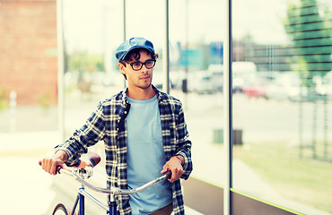 Image showing hipster man walking with fixed gear bike