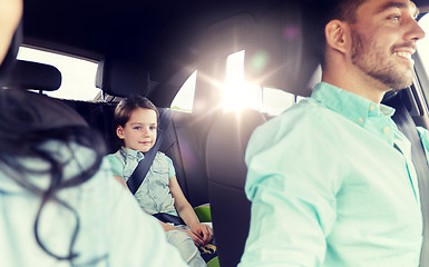 Image showing happy family with little child driving in car