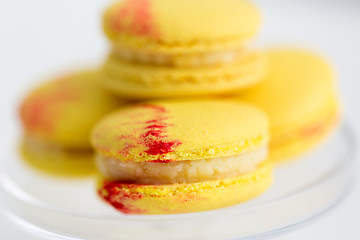 Image showing close up of yellow macarons on confectionery stand