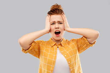 Image showing terrified red haired teenage girl screaming