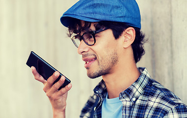 Image showing man using voice command or calling on smartphone