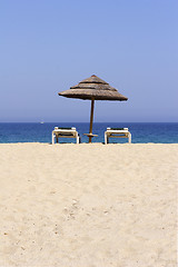 Image showing sun lounger on empty sandy beach