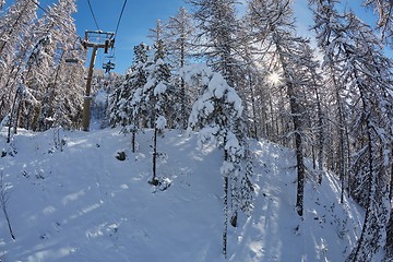 Image showing Ski resort in the mountains, ski lift ascend