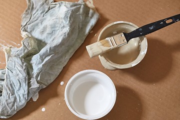 Image showing Paint brush on a can of white wall paint