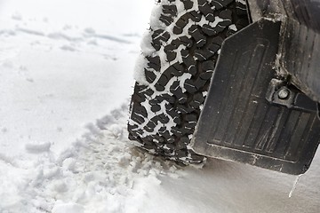 Image showing Car tyre in snow