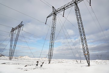 Image showing Electric lines on snow