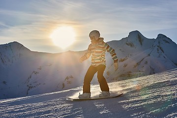 Image showing Snowboarder in sun flare, water drops on lens