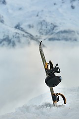 Image showing Snowboard high up in the snowy Alps