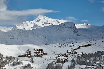 Image showing Snowy mountain landscape with skiing resort village and lifts