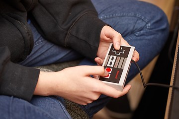 Image showing Nintengo NES,playing Super Mario 3