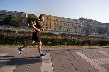 Image showing man jogging at sunny morning