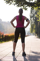 Image showing woman jogging at sunny morning