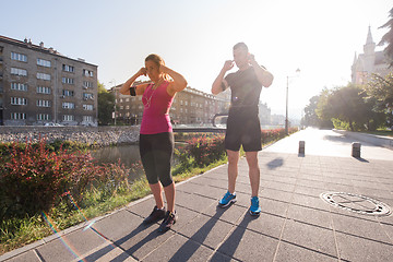 Image showing young couple jogging  in the city