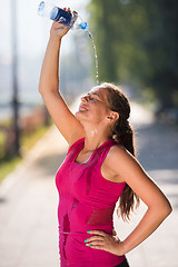 Image showing woman pouring water from bottle on her head