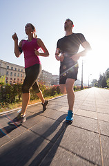 Image showing young couple jogging  in the city