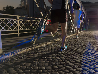 Image showing young people jogging across the bridge