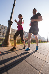 Image showing young couple jogging  in the city