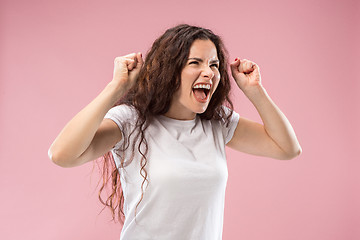 Image showing Portrait of an angry woman isolated on a pink background