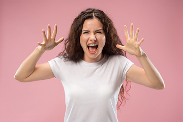 Image showing Portrait of an angry woman isolated on a pink background